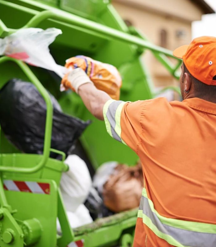 one-mans-trash-cropped-shot-of-a-garbage-collect-2023-11-27-04-59-26-utc.jpg